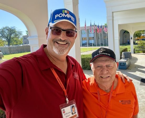 Two smiling alumni reconnecting — photo 28