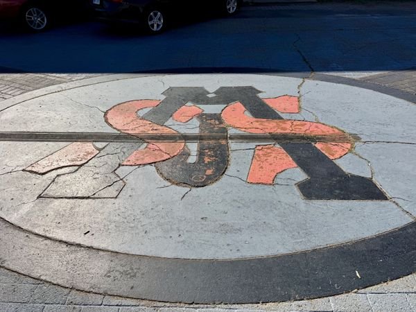 The Saint John’s emblem on the pavement — photo 30